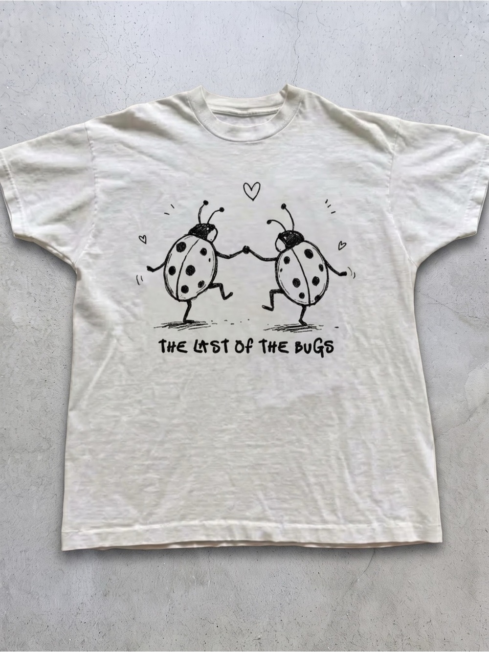Gildan White Short Sleeve Tee with Black
Ladybug Graphic